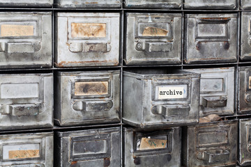 Archive old style interior. Closed metallic storage, filing cabinet. aged silver metal boxes with...