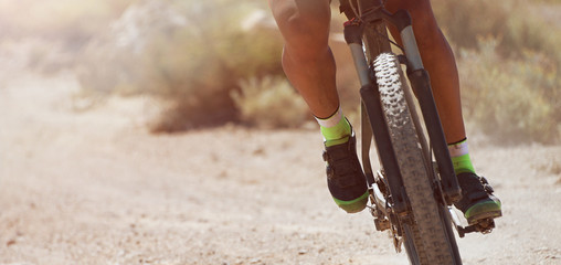 Downhill mountain bike on a forest path, active athlete doing sport