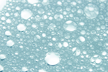 Soapsuds background with air bubbles abstract texture. Blur