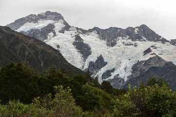 Fototapeta na wymiar Mountain peaks covered by ice seen from Mount Cook Village, Aoraki / Mount Cook National Park, New Zealand