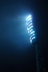 Stadium Lights against Dark Night Sky Background