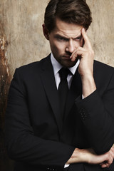 Thoughtful businessman looking down