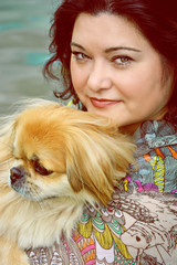 A lady with a little dog