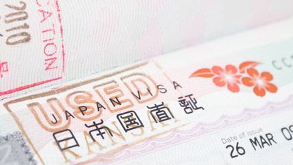 Used japan visa in foreign passport sheet with stamp