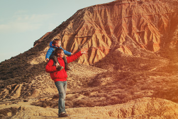 father and son travel in scenic mountains