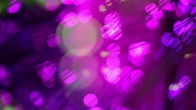 Multicolored lights with bokeh, defocused motion abstract background