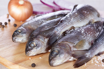 Lightly salted grayling on a chopping board