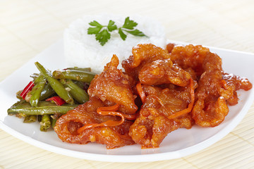 Chinese cuisine. Pork in batter and sweet and sour sauce with green beans in Sichuan