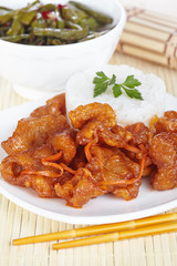 Chinese cuisine. Pork in batter and sweet and sour sauce with green beans in Sichuan