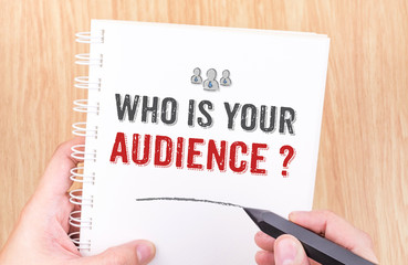 Who is your audience? word on white ring binder notebook with ha