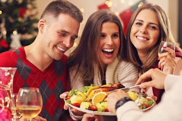 Group of friends celebrating Christmas