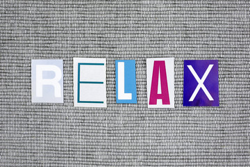 relax word on grey background