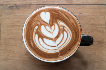 Hot cup of latte art coffee