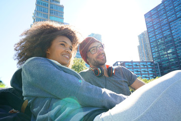 Hipster couple relaxing in park in NYC