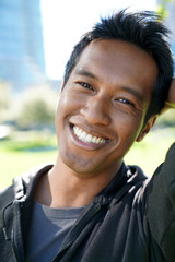 Closeup of asian type man relaxing at the park