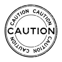 Grunge black caution rubber stamp