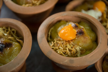 Ancient Thai Dessert (MOR-KAW-MOR-KANG-BO-RAN) available in Thai market,Thai sweets,in a small clay cups