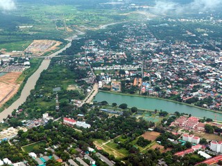 Aerial view over the town in Thailand. City skyline background.