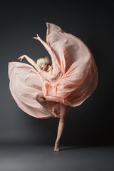 Woman dancing in chiffon dress