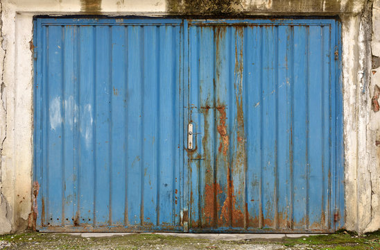 Grunge metallic blue garage door