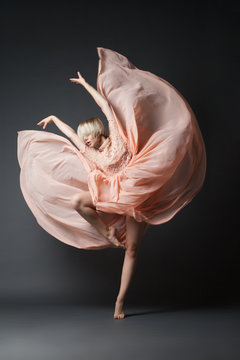 Woman dancing in chiffon dress