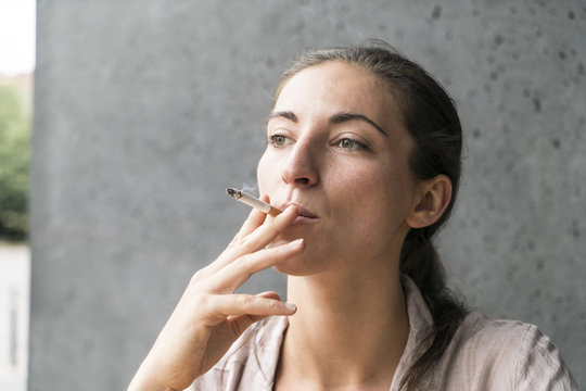 Portrait of smoking young woman