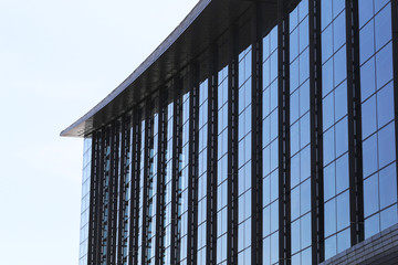 Modern office building  from low perspective with blue sky in the background.