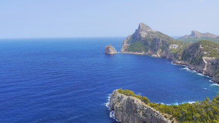 Cape: sea and rocks and woods