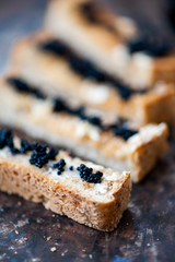 Black caviar on a toast with butter