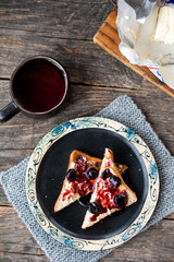 Toast with butter and sour cherry jam