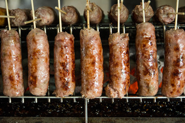 Big thai spice sausage on grill,It smells fragrant and full of thai spice.At 