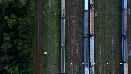 Aerial view of railroad station. Trains and Carriages in a sump.