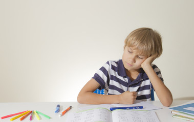 Little kid at home doing homework