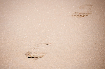 Footprints In The Sand At The Beach