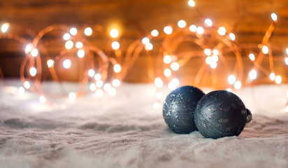 Silver Christmas Ornaments and garland on Snowy Background