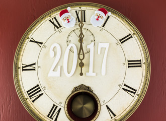 Naklejka na ściany i meble Beginning of 2017 New Year celebration. Clock shows midnight.