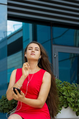 woman listening music on the street