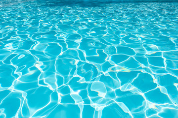 Ripple Water in swimming pool with sun reflection