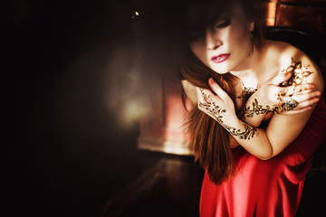 beautiful girl with red hair posing in Studio