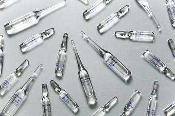 Medical ampoules on a grey background