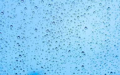 Drops of water on blue glass