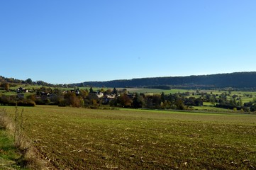 Fototapeta premium Plow fields with a background