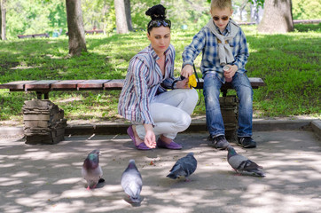 family feeding pigeon