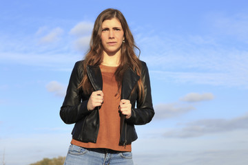 Beautiful young woman outdoors in the country