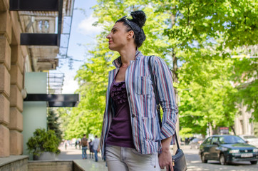 girl stand beside shopping window