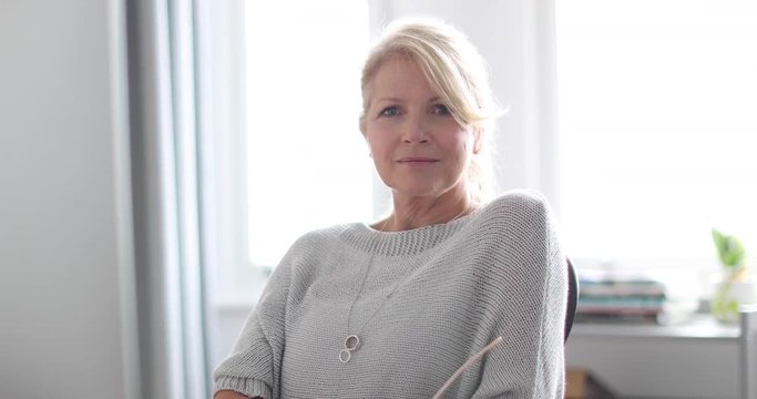 Portrait of mature business woman in office