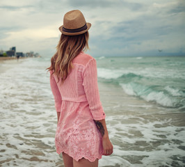 Beautiful woman walking along the South beach, Miami