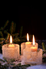 Fototapeta na wymiar Christmas background fir tree burning candle Winter background