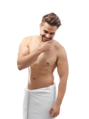 Fototapeta premium Handsome man in towel isolated white
