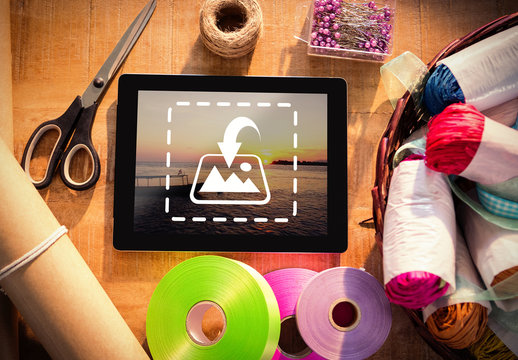Tablet on Table with Wrapping Supplies Mockup 2
